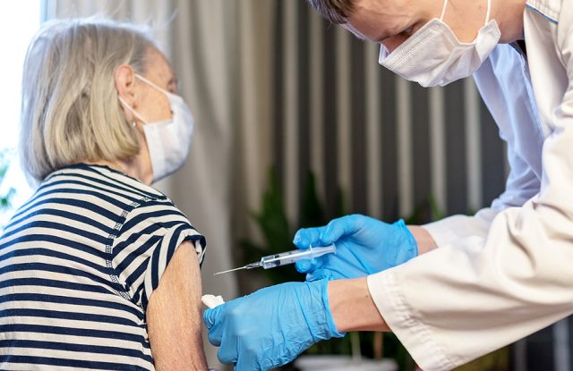 85-year-old Woman Receives The Covid-19 Vaccine From A Doctor At